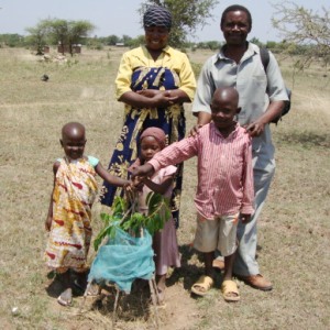 Newly planted tree with family.