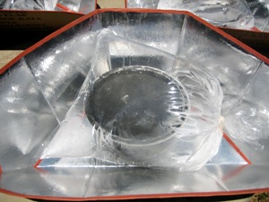 Closeup of solar Cookkit with pot inside a plastic bage.