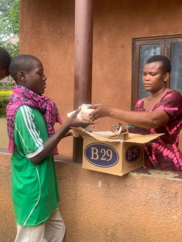 Martha-distributing-soap-to-the-kids-in-Musoma